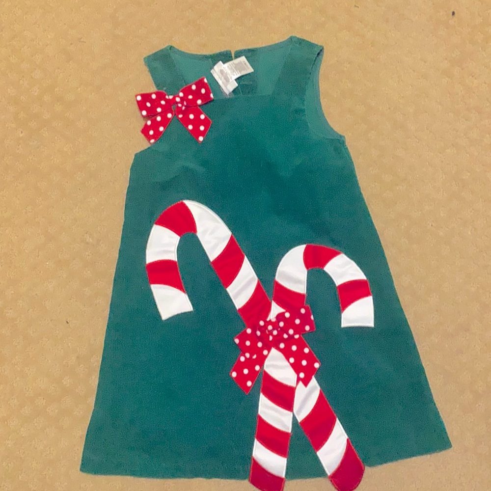 Adorable girls emerald  green Christmas dress with candy canes .